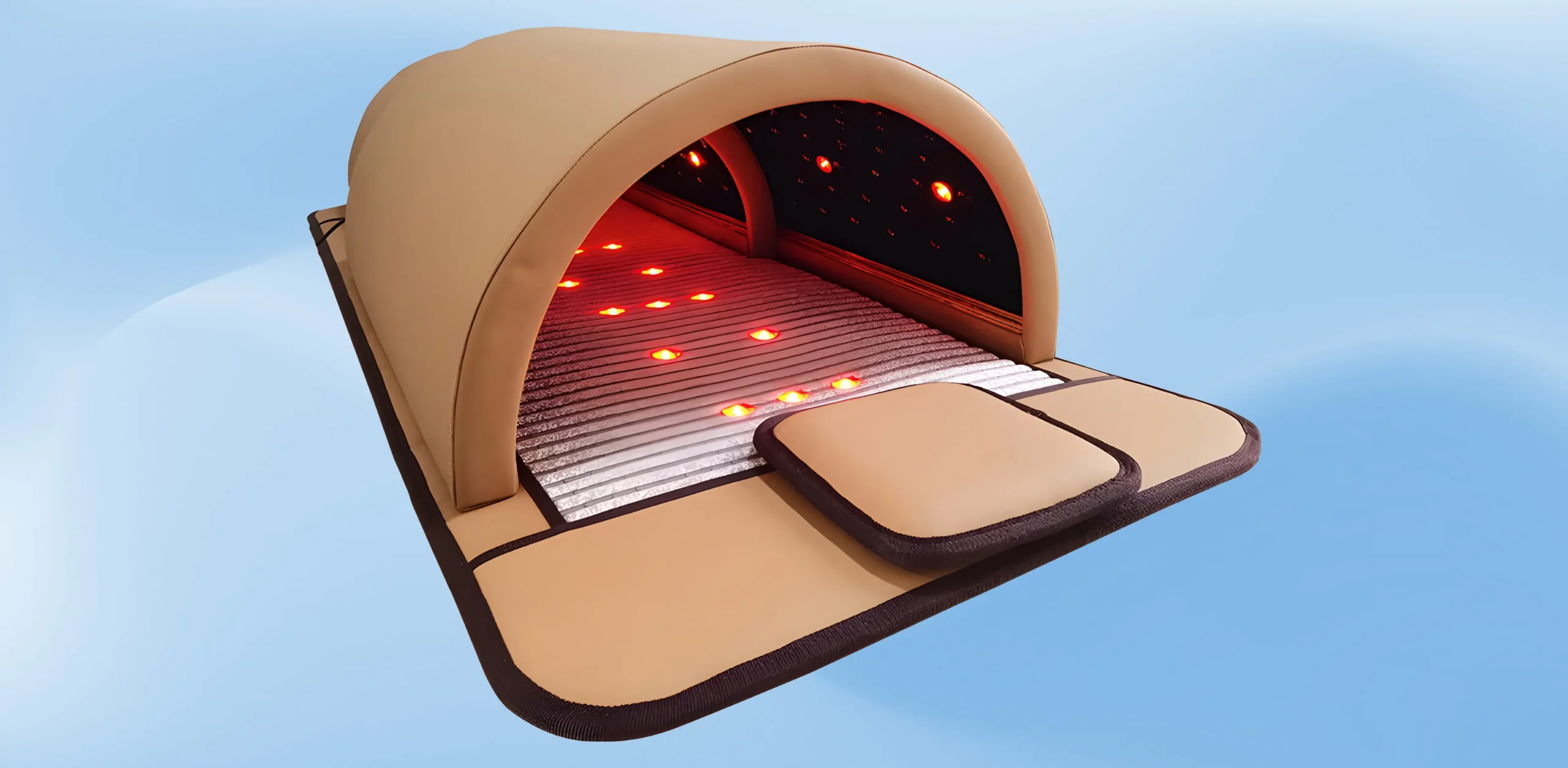 Drone spraying crops over a large green field with trees and hills in the background.